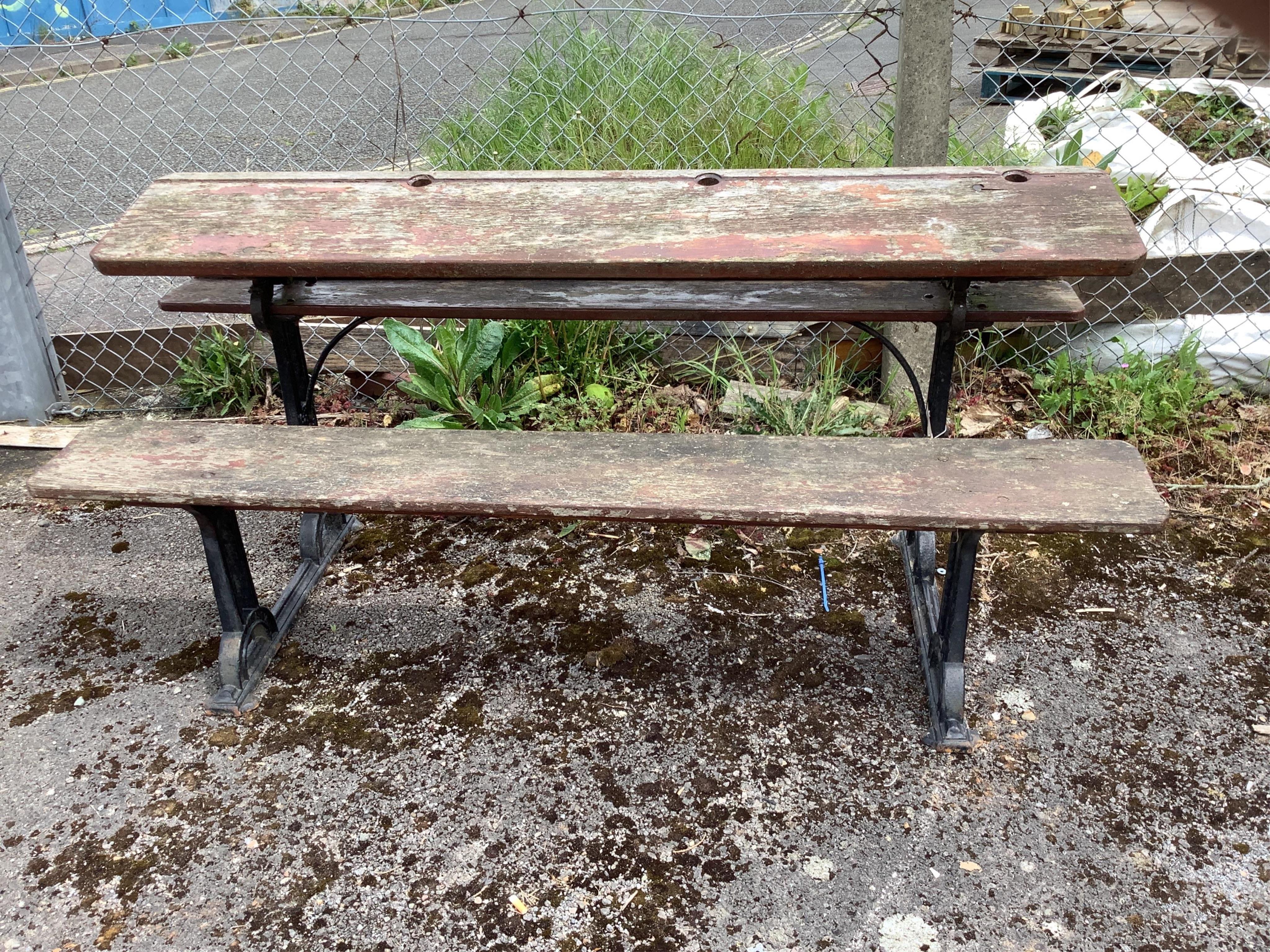 A vintage cast iron and painted wood triple student's desk by H & S Addison, Stafford, width 168cm, depth 60cm, height 75cm